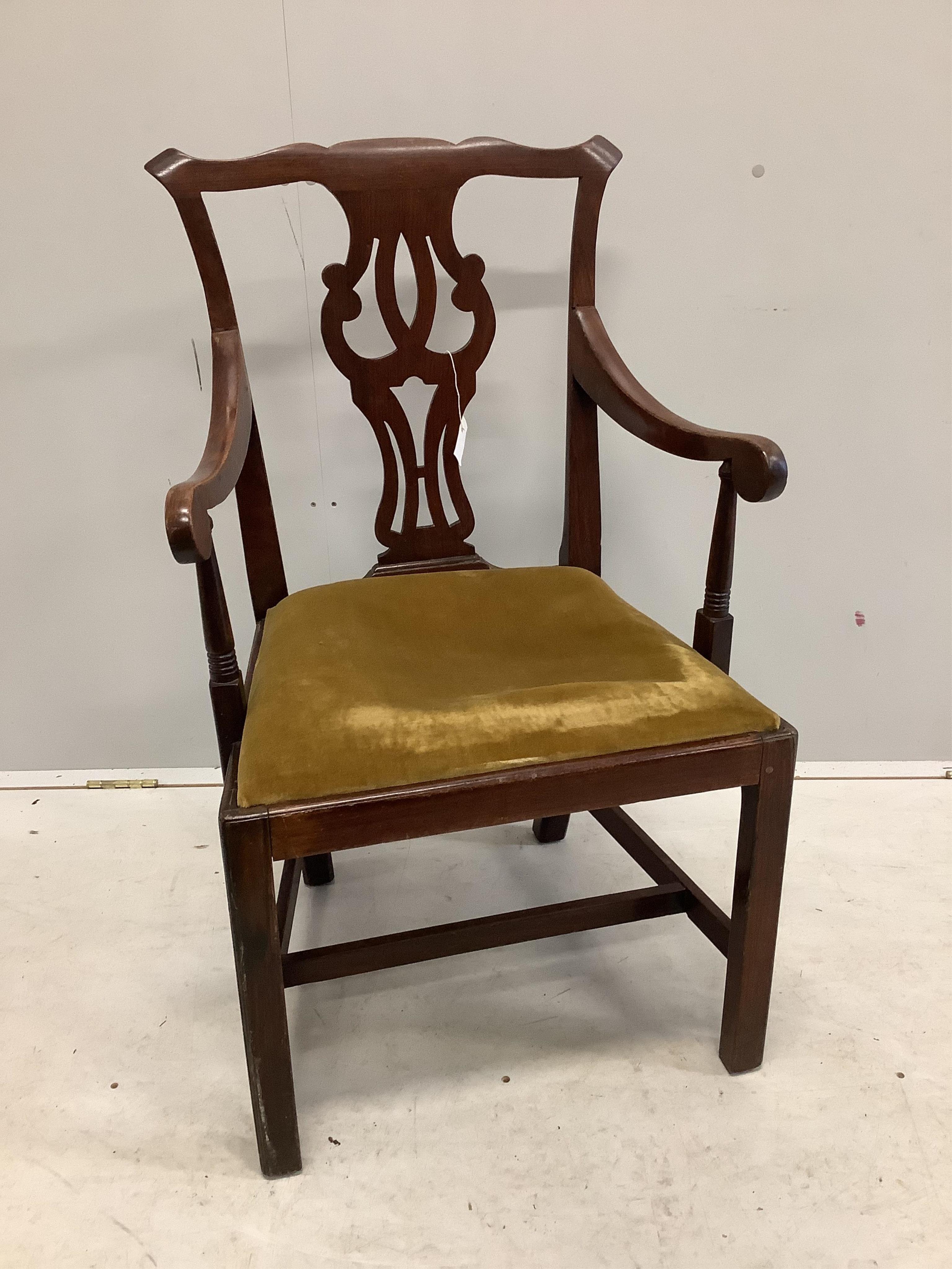 A George III Chippendale style mahogany elbow chair with a later similar elbow chair. Condition - fair